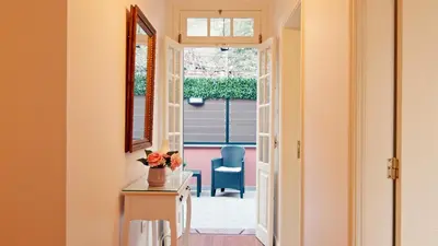 a hallway with a door leading to a patio at Du.Val - Madeira Valley Villa in Ribeira Brava