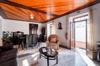 a living room with a wooden ceiling at Casa Lucas by Stay Madeira in Ponta do Sol