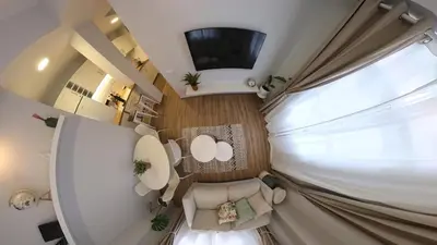 an overhead view of a living room with a large window at Machico Heart Suites in Machico