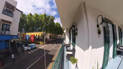 a view of a street from a balcony of a building at Machico Heart Suites in Machico