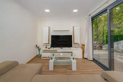 a living room with a tv and a couch at Casa da Quebrada in Santana