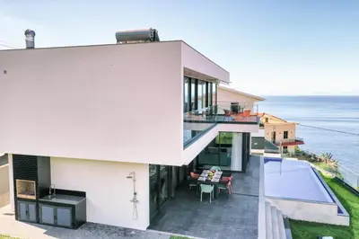 a house with a view of the ocean at Villa Ocean Haven by AH in Ribeira Brava
