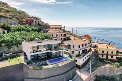 an aerial view of a house next to the ocean at Villa Ocean Haven by AH in Ribeira Brava