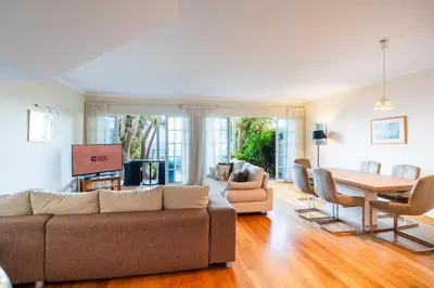 a living room with a couch and a table at GuestReady - Madeiran paradise with ocean view in Funchal