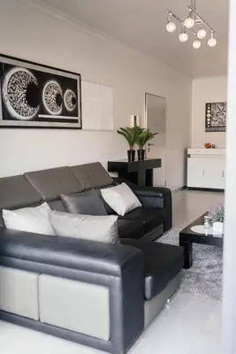 a living room with a couch and a table at Luxurious Lido-Sun Island X1V Apt.Free parking in Funchal