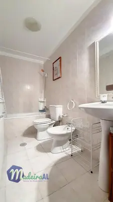 a white bathroom with a toilet and a sink at Linda´s Studio in Funchal