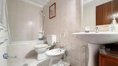 a white bathroom with a sink and a toilet at Linda´s Studio in Funchal