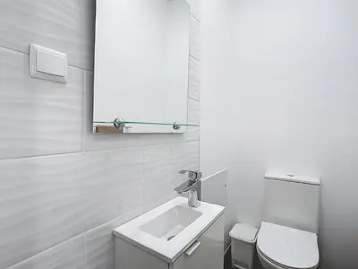 a white bathroom with a sink and a toilet at Gomes House by Atlantic Holiday in Ponta do Sol