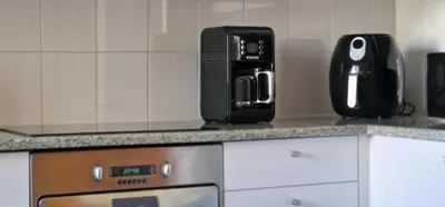 a kitchen counter with a coffee maker and a microwave at Glorious Apartment by LovelyStay in Funchal