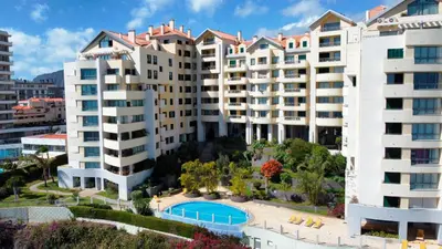 an aerial view of apartment buildings with a swimming pool at Glorious Apartment by LovelyStay in Funchal