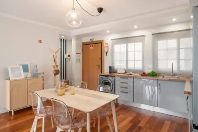 a kitchen with a table and chairs in a room at Santa Cruz I by An Island Apart in Santa Cruz