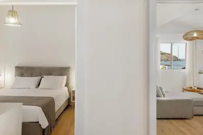 a bedroom with a bed and a window at Sunset house in Paul do Mar
