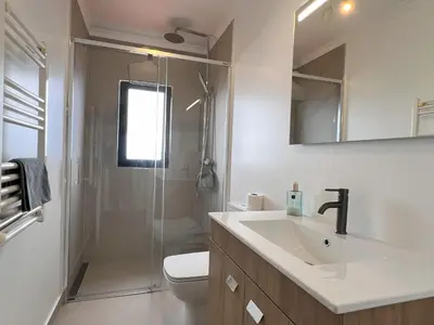 a bathroom with a sink and a toilet and a shower at Casa da Ovelha I Madeira in Fajã da Ovelha