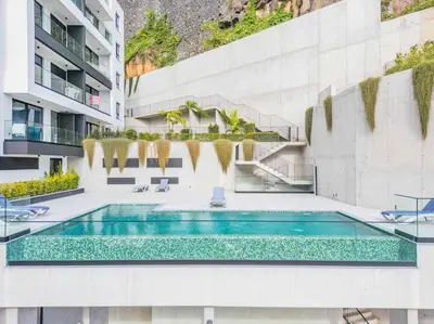 a swimming pool in the middle of a building at CENTRAL LOCATION - WITH POOL in Funchal