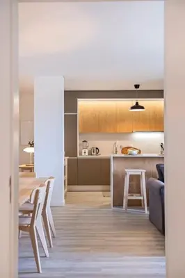 a kitchen and dining room with a table and chairs at CENTRAL LOCATION - WITH POOL in Funchal
