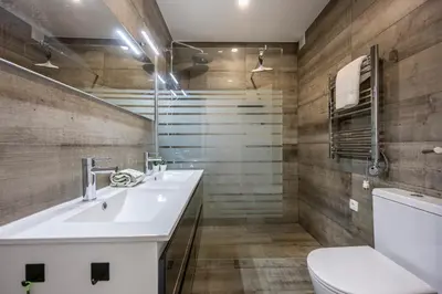 a bathroom with a sink and a toilet at Waterside Village - Oceanview Dream in Luz