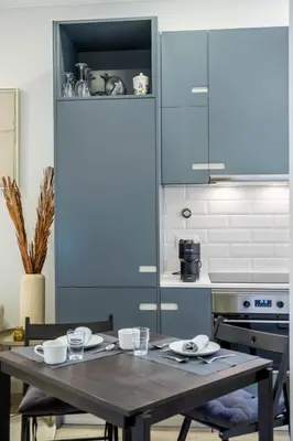 a kitchen with a table with dishes on it at Ponte Nova Studios in Funchal