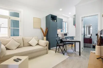 a living room with a couch and a table at Ponte Nova Studios in Funchal