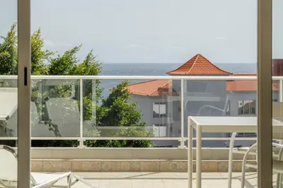 a balcony with a view of the ocean at Costa Apartment II - Linda Vista in Caniço
