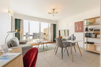 a living room with a couch and a table at Costa Apartment II - Linda Vista in Caniço