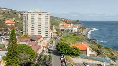 a view of a city with the ocean and buildings at Costa Apartment II - Linda Vista in Caniço