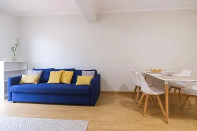 a living room with a couch and a table at Brava Home - Best Location to Explore Madeira in Ribeira Brava