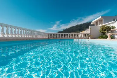 a large swimming pool next to a building at GuestReady - Peaceful Paradise in Madeira in Arco da Calheta
