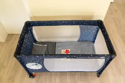 a suitcase with stars on it sitting on a floor at Florenças House - Private Jacuzzi & Garden in Calheta