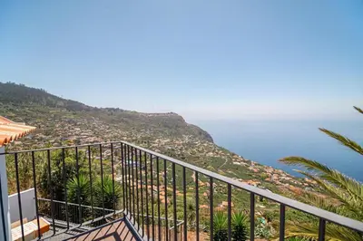 a view of the ocean from a balcony at Calheta Bay View House - Family and Group Residence in Arco da Calheta