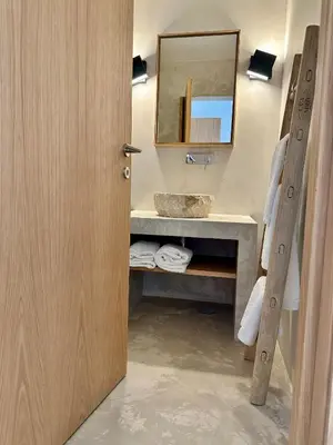 a bathroom with a sink and a mirror at Casa Malìa Luxury Guest House in Luz