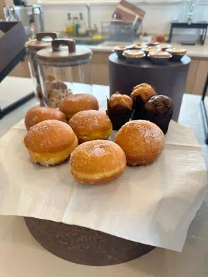 a bunch of donuts sitting on top of a plate at Casa Malìa Luxury Guest House in Luz