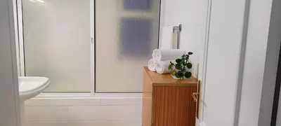 a bathroom with a sink and a toilet at Sol e Mar in Ponta do Sol