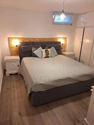 a bedroom with a large bed with a dog on it at Happy Stay Funchal in Funchal