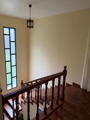 an empty room with a staircase and a window at Mountain retreat in Boaventura