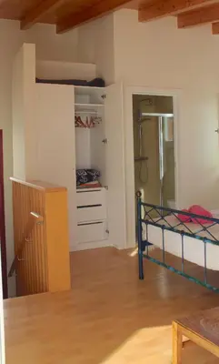 a bedroom with a bunk bed and a closet at Estudio Hortas in Vila do Bispo