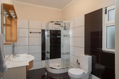 a bathroom with a shower and a toilet and a sink at OurMadeira - Vista Mar in Canhas