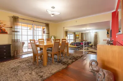 a dining room with a table and chairs at The Mountain View, By OP in São Vicente