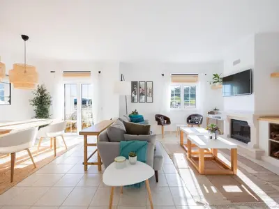a living room with a couch and a table at Dream Retreat in Budens #1948 in Budens