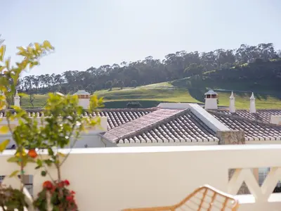 a view of a golf course from the roof of a building at Dream Retreat in Budens #1948 in Budens