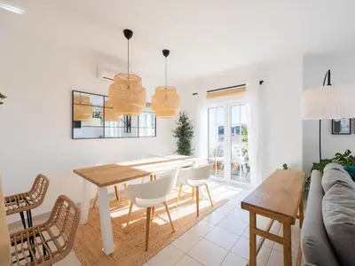 a kitchen and dining room with a table and chairs at Dream Retreat in Budens #1948 in Budens