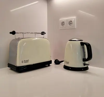 two toasters sitting on a counter next to each other at Bela Vista_ Cozy Apartment with Sea View in Aljezur
