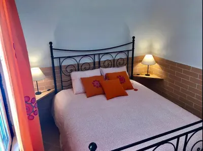 a living room with a couch and a table at Casa Sagres in Vila do Bispo