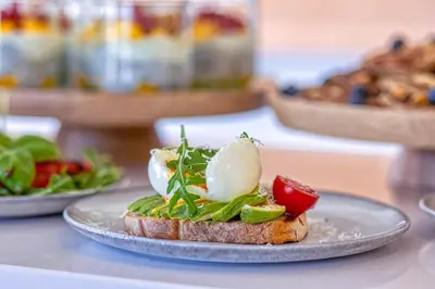 a piece of bread with vegetables on a plate at Sunday Morning Guesthouse in Aljezur