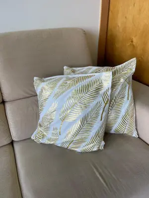 two pillows sitting on top of a couch at Casa do mar in São Vicente