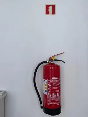 a fire extinguisher is hanging on a wall at Vila São Gonçalo in Funchal