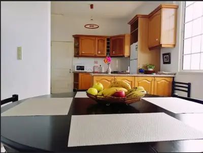 a bowl of fruit on a table in a kitchen at Vila São Gonçalo in Funchal