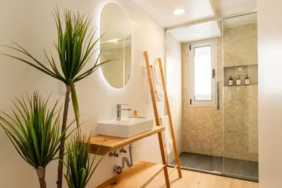 a bathroom with a sink and a shower at Bella Vista (Heated Pool & Private Parking) in Arco da Calheta