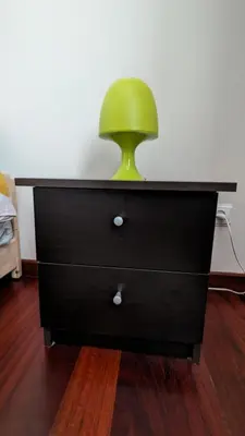 a green chair sitting on top of a dresser at Levada Nova House in Ponta do Sol