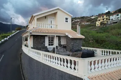 a small house on the side of a road at Levada Nova House in Ponta do Sol
