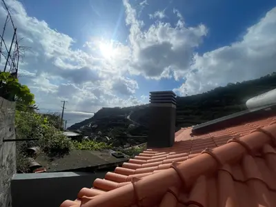 a view of the sun from the roof of a house at Dream Home in Calheta